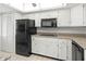 Kitchen with white cabinets, modern appliances, and ample countertop space at 7500 40Th W Ave # 108, Bradenton, FL 34209