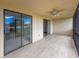 This screened lanai offers outdoor living space with a ceiling fan and sliding glass doors to the inside at 7500 40Th W Ave # 108, Bradenton, FL 34209