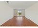 A living room with wood floors and a large window to the outdoors at 7500 40Th W Ave # 108, Bradenton, FL 34209