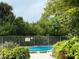 Community pool with lush landscaping, providing a serene and inviting outdoor recreation space at 7500 40Th W Ave # 108, Bradenton, FL 34209