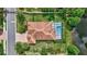 Aerial shot of a well-maintained home featuring a screened-in pool and lush, landscaped backyard at 7705 55Th E St, Ellenton, FL 34222