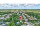 An aerial view of a home in a quiet neighborhood surrounded by lush greenery at 7705 55Th E St, Ellenton, FL 34222