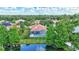 Aerial shot of property with screened pool and landscaped yard at 7705 55Th E St, Ellenton, FL 34222