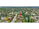 Aerial view of a well-kept home backing to a pond in a tranquil neighborhood at 7705 55Th E St, Ellenton, FL 34222