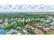 Aerial view of a well-kept home in a tranquil neighborhood with lush greenery at 7705 55Th E St, Ellenton, FL 34222