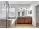 Well-lit bathroom with tiled shower and tub combo, dual vanity and granite countertops at 7705 55Th E St, Ellenton, FL 34222