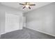 Neutral bedroom with a standard closet, carpet flooring, and light colored walls at 7705 55Th E St, Ellenton, FL 34222