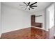 Bedroom with wood floors featuring a modern wall-mounted cabinet and shelf unit at 7705 55Th E St, Ellenton, FL 34222