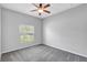 This bedroom features neutral walls, plush carpeting and a window providing natural light at 7705 55Th E St, Ellenton, FL 34222