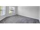 This bedroom features plush carpeting and a large double window providing natural light at 7705 55Th E St, Ellenton, FL 34222