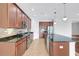 Modern kitchen with stainless steel appliances, granite countertops, and tile backsplash at 7705 55Th E St, Ellenton, FL 34222