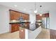 Well-equipped kitchen with island, stainless steel appliances, and stylish pendant lighting at 7705 55Th E St, Ellenton, FL 34222