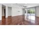 Spacious living room with hardwood floors and sliding glass doors leading to the screened-in lanai at 7705 55Th E St, Ellenton, FL 34222