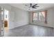 Bright main bedroom with tiled floors, large windows, and bathroom entrance at 7705 55Th E St, Ellenton, FL 34222