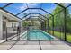Enclosed pool featuring a safety fence, perfect for Gathering fun and safety in a private backyard setting at 7705 55Th E St, Ellenton, FL 34222
