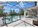 Inviting screened-in pool and spa area with ample patio space for entertaining and relaxation at 7705 55Th E St, Ellenton, FL 34222