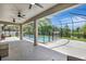 An inviting screened-in pool area offers refreshing enjoyment, plus a peaceful view of the serene backyard pond at 7705 55Th E St, Ellenton, FL 34222