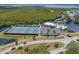 Resort-style community featuring tennis courts, pool, and clubhouse surrounded by lush greenery and scenic waterways at 805 Waterside Ln # 805, Bradenton, FL 34209