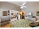 Cozy bedroom with neutral walls, white trim and a glimpse of the living room at 805 Waterside Ln # 805, Bradenton, FL 34209