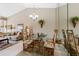 Open dining room features a glass table, seating for four, and is adjacent to the living room area at 805 Waterside Ln # 805, Bradenton, FL 34209