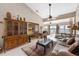 Bright living room offers tile flooring, neutral walls, and access to a sunroom with expansive views at 805 Waterside Ln # 805, Bradenton, FL 34209