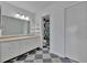 Bathroom featuring a single sink vanity, and a walk-in shower with black and white tile at 8710 54Th W Ave # 8710, Bradenton, FL 34210