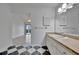 Bathroom with black and white tile floor, white cabinets, and a walk-in shower at 8710 54Th W Ave # 8710, Bradenton, FL 34210