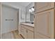 Bright bathroom features a vanity with drawers and cabinets, a decorative mirror and tiled floors at 8710 54Th W Ave # 8710, Bradenton, FL 34210