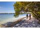 Scenic beach walk with two women and a enjoying a stroll along the shoreline at 8710 54Th W Ave # 8710, Bradenton, FL 34210