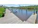 Wooden boat dock with sturdy pilings offers direct access to tranquil waterways at 8710 54Th W Ave # 8710, Bradenton, FL 34210