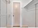 A walk-in closet with shelves, a hanging rack and a door at 8710 54Th W Ave # 8710, Bradenton, FL 34210