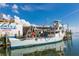 Commercial fishing boat docked on the water under a bright, sunny sky at 8710 54Th W Ave # 8710, Bradenton, FL 34210