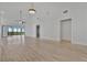 Bright and spacious living room with vaulted ceiling, tile flooring, and slider to balcony at 8710 54Th W Ave # 8710, Bradenton, FL 34210