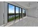 Bright living room with floor-to-ceiling windows offering water views at 8710 54Th W Ave # 8710, Bradenton, FL 34210
