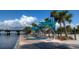 Picturesque waterfront walkway featuring modern shade structures and seating, perfect for relaxation and enjoying the scenery at 8710 54Th W Ave # 8710, Bradenton, FL 34210