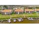 Aerial view of waterfront homes with private docks, boats, lush lawns, and tranquil water views at 8710 54Th W Ave # 8710, Bradenton, FL 34210