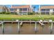 Waterfront home with private boat dock, landscaped lawn, and lush greenery, offering serene coastal living at 8710 54Th W Ave # 8710, Bradenton, FL 34210