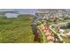 Aerial shot showing waterfront homes with docks, canals, and lush vegetation, perfect for boating and relaxation at 8710 54Th W Ave # 8710, Bradenton, FL 34210
