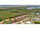 Aerial view of a waterfront community, docks, lush surroundings, and tranquil waterways for boating enthusiasts at 8710 54Th W Ave # 8710, Bradenton, FL 34210