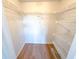 Walk-in closet with built-in wire shelving for organized storage at 970 Virginia St # 109, Dunedin, FL 34698