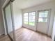 Bright Florida room with sliding glass doors, lots of natural light, and vinyl flooring at 970 Virginia St # 109, Dunedin, FL 34698