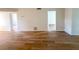 This living room features luxury vinyl plank flooring and neutral paint at 970 Virginia St # 109, Dunedin, FL 34698