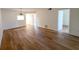 This living room features luxury vinyl plank flooring and neutral paint at 970 Virginia St # 109, Dunedin, FL 34698