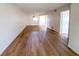 Spacious living room featuring hardwood floors and neutral-toned walls, perfect for any decor at 970 Virginia St # 109, Dunedin, FL 34698
