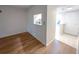 This living room features luxury vinyl plank flooring and neutral paint at 970 Virginia St # 109, Dunedin, FL 34698