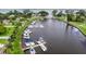 Aerial view of a canal with multiple boats docked at a private marina on a sunny day at 1021 Estremadura Dr, Bradenton, FL 34209