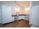 Spacious bathroom with dual vanity, white cabinets, granite countertops, and shower with a white curtain at 1021 Estremadura Dr, Bradenton, FL 34209