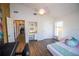 Bright bedroom with a ceiling fan, white walls and a desk off to the side at 1021 Estremadura Dr, Bradenton, FL 34209