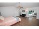 Cozy bedroom featuring a ceiling fan and sliding doors to the screened pool at 1021 Estremadura Dr, Bradenton, FL 34209