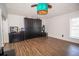 Bedroom featuring wood floors, a ceiling fan, and a large cabinet at 1021 Estremadura Dr, Bradenton, FL 34209